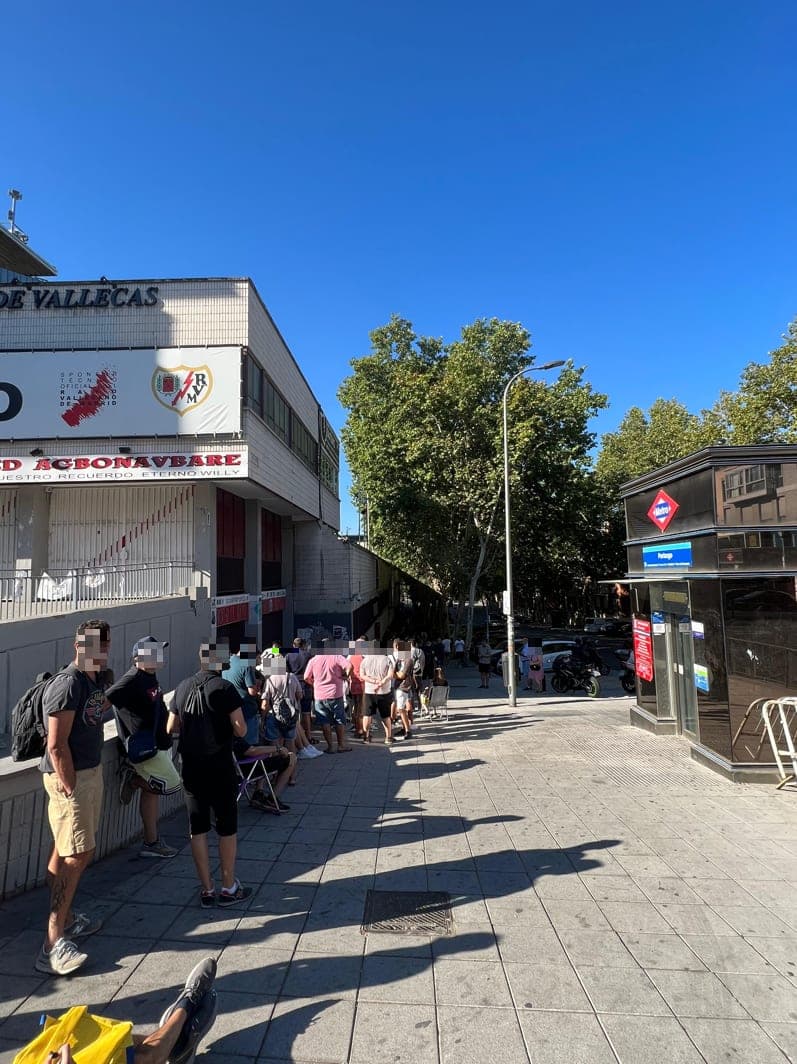 Supporters queueing at the Vallecas ticket windows, with Portazgo metro station on the right